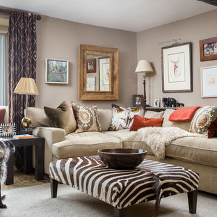 This is an example of a medium sized country enclosed living room in Gloucestershire with beige walls.
