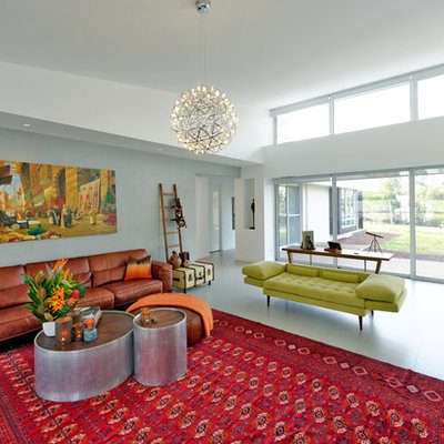 Large trendy open concept living room photo in Melbourne with gray walls