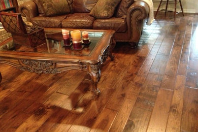 Inspiration for a mid-sized timeless open concept medium tone wood floor and brown floor living room remodel in Dallas
