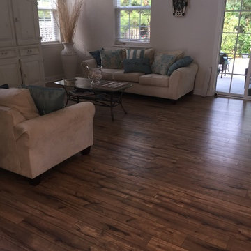 Wood look laminate replaces builder-grade cherry for a pet-friendly home
