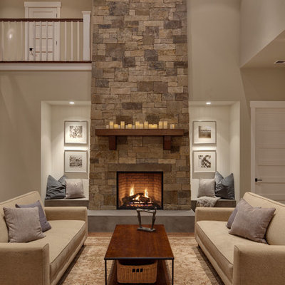 Example of a transitional living room design in Seattle with beige walls, a standard fireplace and a stone fireplace