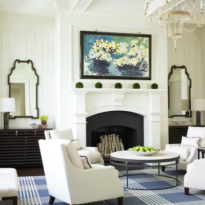 Elegant living room photo in Atlanta with white walls, a standard fireplace and no tv