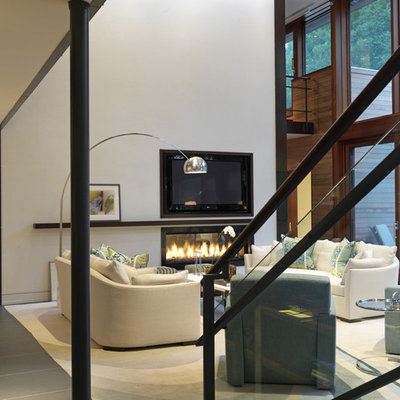 Example of a trendy living room design in Baltimore with white walls, a ribbon fireplace and a wall-mounted tv