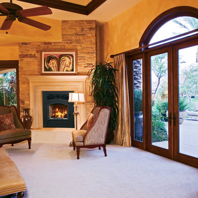 Elegant living room photo in Orange County with a standard fireplace