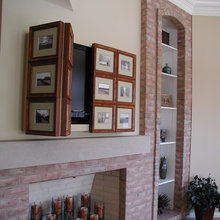 Gas stove with masonry surround and flat screen tv