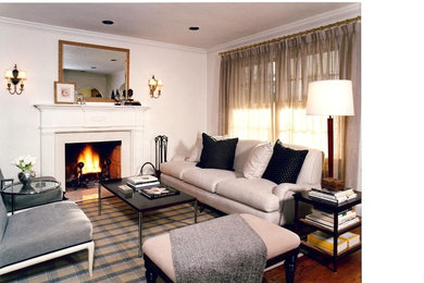 Photo of a medium sized classic formal living room in New York with white walls, medium hardwood flooring, a standard fireplace and a tiled fireplace surround.