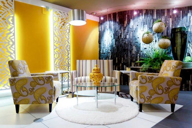 Example of a trendy ceramic tile living room design in Grand Rapids with yellow walls