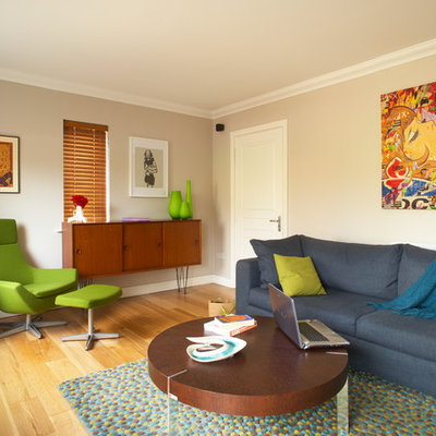 Example of an eclectic living room design in Dublin with beige walls