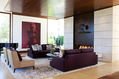 This is an example of a large modern formal open plan living room in San Francisco with white walls, a ribbon fireplace, a metal fireplace surround, no tv, porcelain flooring and beige floors.