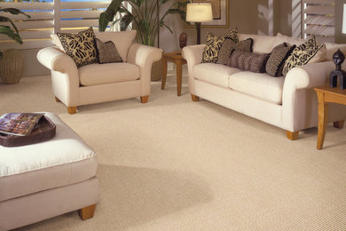 Photo of a medium sized traditional enclosed living room in Indianapolis with beige walls, carpet and beige floors.