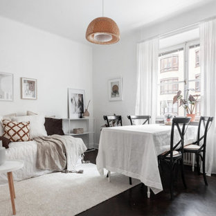 Idéer för att renovera en liten minimalistisk matplats, med vita väggar och svart golv
