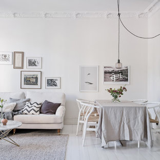Idéer för att renovera en skandinavisk matplats med öppen planlösning, med vita väggar, målat trägolv och vitt golv