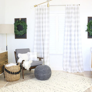 Example of a mid-sized country gender-neutral nursery design in Other with white walls