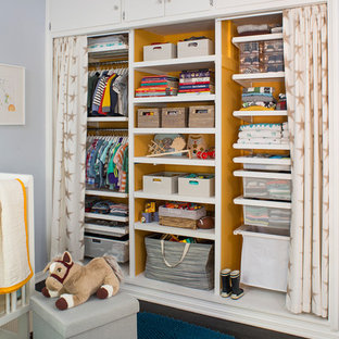 Transitional boy dark wood floor nursery photo in Other with blue walls