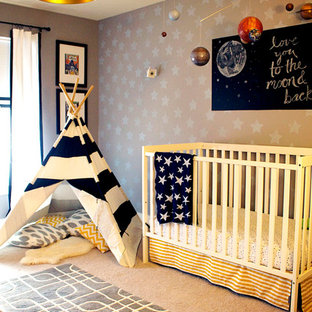 This is an example of a medium sized eclectic nursery for boys in Indianapolis with grey walls and carpet.