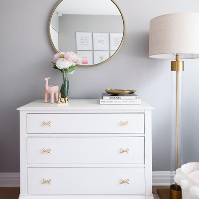 Example of a small transitional girl carpeted and pink floor nursery design in New York with gray walls