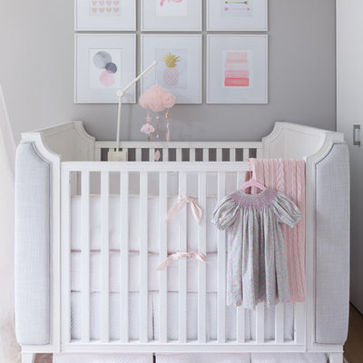 Example of a small transitional girl carpeted and pink floor nursery design in New York with gray walls