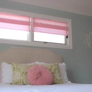 Mid-sized elegant girl medium tone wood floor nursery photo in Orange County with gray walls