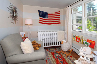 This is an example of a small eclectic nursery in Boston.