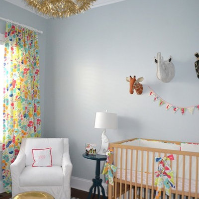 Nursery - traditional girl dark wood floor nursery idea in Wilmington with gray walls