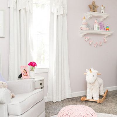 Nursery - mid-sized transitional girl carpeted and gray floor nursery idea in Raleigh with pink walls