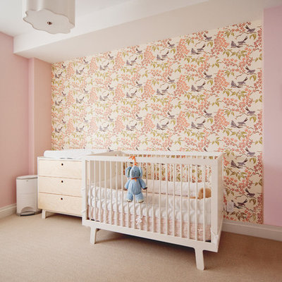 Nursery - mid-sized transitional girl carpeted and beige floor nursery idea in New York with pink walls