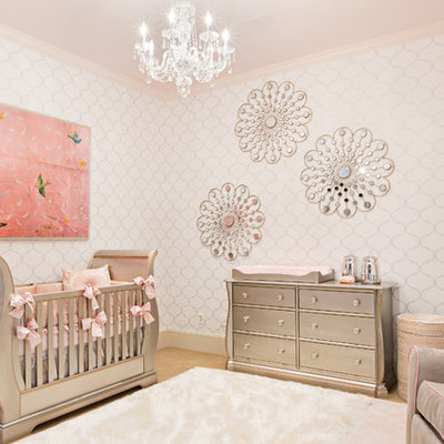 Inspiration for a mid-sized transitional girl carpeted nursery remodel in Other with white walls