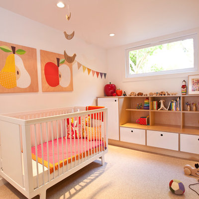 Inspiration for a scandinavian girl carpeted nursery remodel in San Francisco with white walls