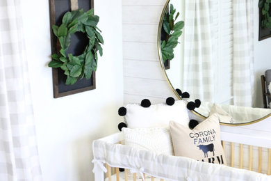 Inspiration for a mid-sized cottage gender-neutral nursery remodel in Other with white walls