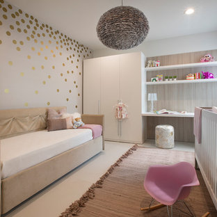 Inspiration for a contemporary girl nursery remodel in Miami with gray walls