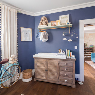 Design ideas for a mid-sized transitional nursery for boys in Sydney with blue walls, dark hardwood floors and brown floor.