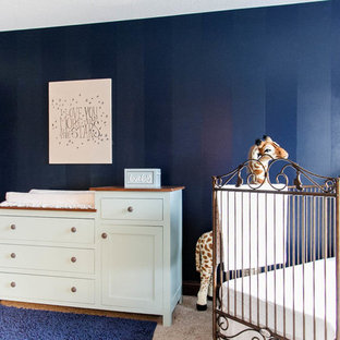 Elegant boy carpeted nursery photo in Minneapolis with blue walls