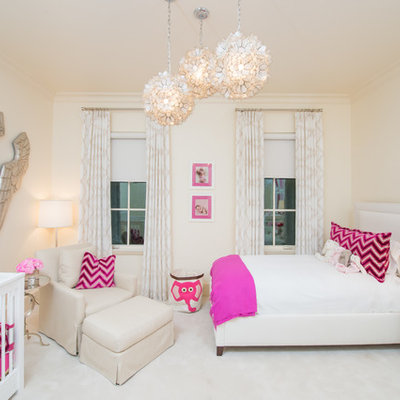 Mid-sized transitional girl carpeted nursery photo in Dallas with beige walls