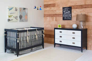 Inspiration for a mid-sized modern boy vinyl floor nursery remodel in Orange County with gray walls