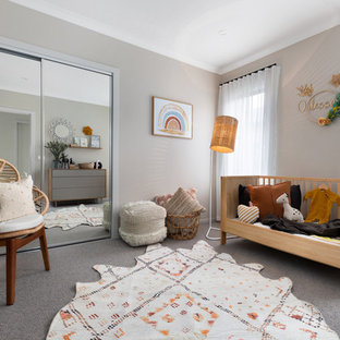 This is an example of a contemporary nursery in Other with grey walls, carpet and grey floor.