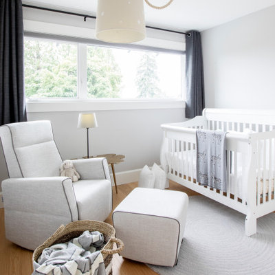 Inspiration for a mid-sized transitional boy beige floor nursery remodel in Vancouver with white walls