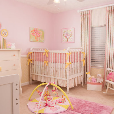 Nursery - mid-sized traditional girl carpeted and pink floor nursery idea in Atlanta with pink walls