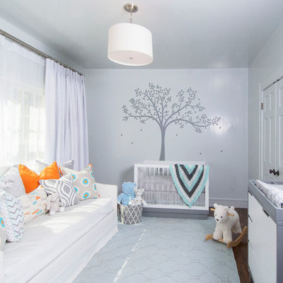 Example of a mid-sized transitional gender-neutral dark wood floor nursery design in Austin with gray walls