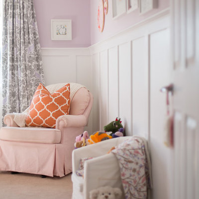Inspiration for a mid-sized transitional girl carpeted nursery remodel in Calgary with purple walls