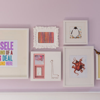 Inspiration for a mid-sized transitional girl carpeted nursery remodel in Calgary with purple walls