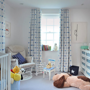 Photo of a traditional nursery for boys in London with white walls.