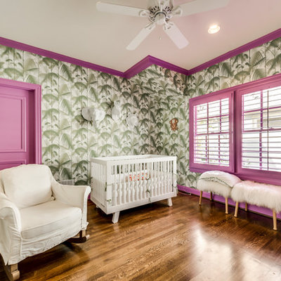 Nursery - contemporary gender-neutral medium tone wood floor and brown floor nursery idea in Dallas with multicolored walls