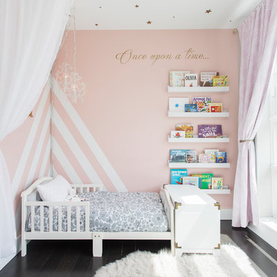 Nursery - mid-sized transitional girl dark wood floor and brown floor nursery idea in New York with gray walls