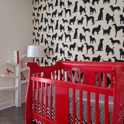 Example of a trendy gender-neutral medium tone wood floor nursery design in Chicago with multicolored walls