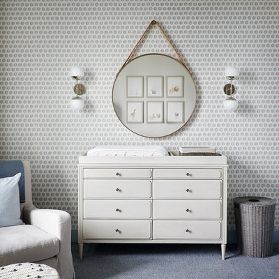 Transitional gender-neutral carpeted and blue floor nursery photo in Chicago with multicolored walls