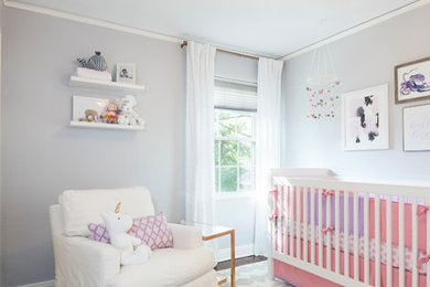 Example of a transitional nursery design in Dallas
