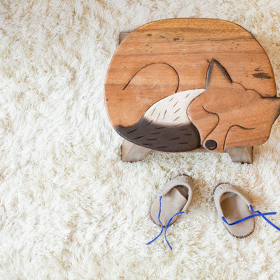 Nursery - small scandinavian gender-neutral bamboo floor and beige floor nursery idea in Seattle with yellow walls