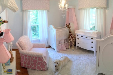 Inspiration for a mid-sized transitional girl nursery remodel in Raleigh