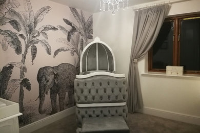 Inspiration for a medium sized traditional nursery for girls in West Midlands with carpet and grey floors.