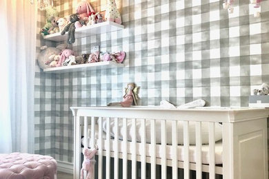 Minimalist girl carpeted and gray floor nursery photo in Other with gray walls